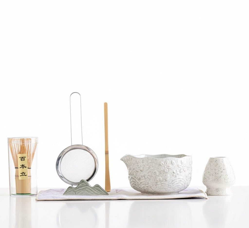 Set of Japanese tea-making tools on a white background